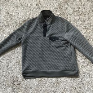 UNTUCKit pullover sweater.